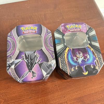 LOT 259D: Sleeved Pokémon Deck, Empty Collectors Tins & More