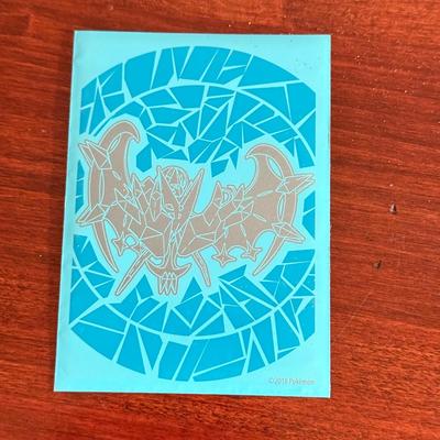 LOT 259D: Sleeved Pokémon Deck, Empty Collectors Tins & More