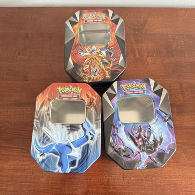 LOT 259D: Sleeved Pokémon Deck, Empty Collectors Tins & More