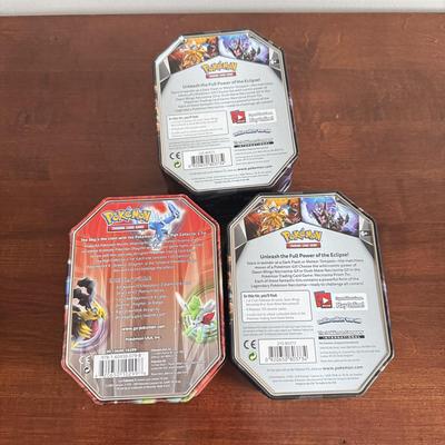LOT 259D: Sleeved Pokémon Deck, Empty Collectors Tins & More