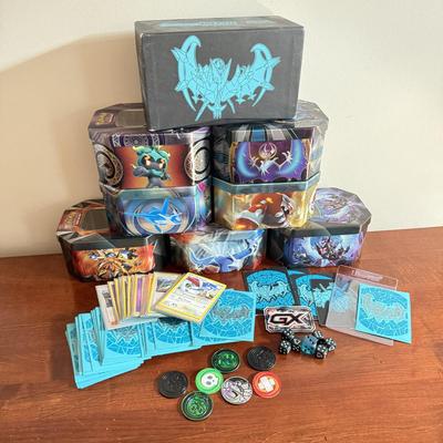 LOT 259D: Sleeved Pokémon Deck, Empty Collectors Tins & More