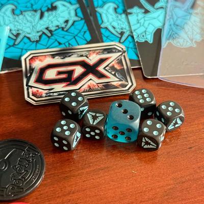 LOT 259D: Sleeved Pokémon Deck, Empty Collectors Tins & More