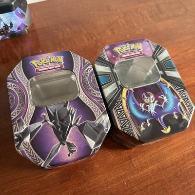 LOT 259D: Sleeved Pokémon Deck, Empty Collectors Tins & More