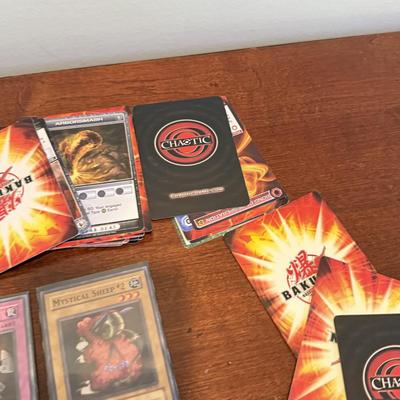 LOT 264: 1996 Yugioh Cards, Heavily Played Pokémon Cards & More