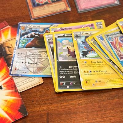 LOT 264: 1996 Yugioh Cards, Heavily Played Pokémon Cards & More