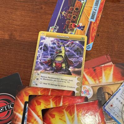 LOT 264: 1996 Yugioh Cards, Heavily Played Pokémon Cards & More