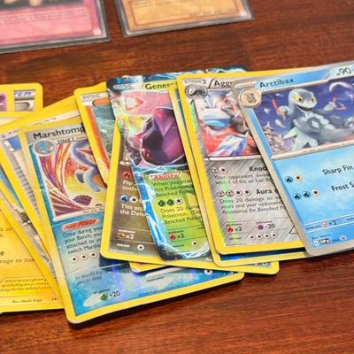 LOT 264: 1996 Yugioh Cards, Heavily Played Pokémon Cards & More