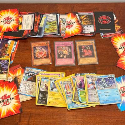 LOT 264: 1996 Yugioh Cards, Heavily Played Pokémon Cards & More