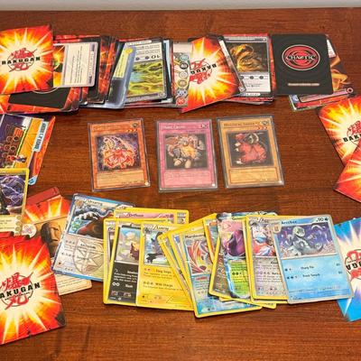 LOT 264: 1996 Yugioh Cards, Heavily Played Pokémon Cards & More