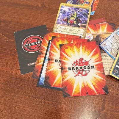 LOT 264: 1996 Yugioh Cards, Heavily Played Pokémon Cards & More