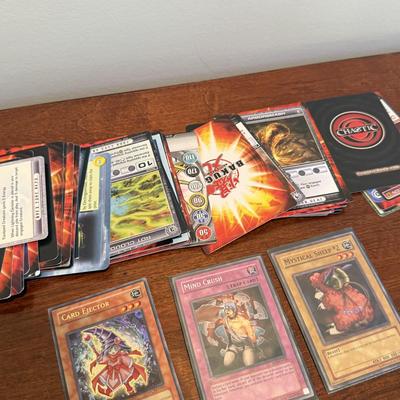 LOT 264: 1996 Yugioh Cards, Heavily Played Pokémon Cards & More