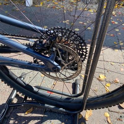 Sale Photo Thumbnail #14: The Santa Cruz Hightower S Kit is a high-quality mountain bike featuring a flat bar handlebar, 29" tubeless tires, and a lightweight carbon fiber frame. This full suspension bike includes adjustable seat, derailleur gears, and hydraulic disc brakes for op