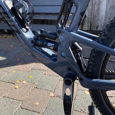 Sale Photo Thumbnail #13: The Santa Cruz Hightower S Kit is a high-quality mountain bike featuring a flat bar handlebar, 29" tubeless tires, and a lightweight carbon fiber frame. This full suspension bike includes adjustable seat, derailleur gears, and hydraulic disc brakes for op