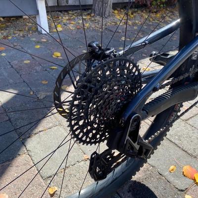 Sale Photo Thumbnail #7: The Santa Cruz Hightower S Kit is a high-quality mountain bike featuring a flat bar handlebar, 29" tubeless tires, and a lightweight carbon fiber frame. This full suspension bike includes adjustable seat, derailleur gears, and hydraulic disc brakes for op