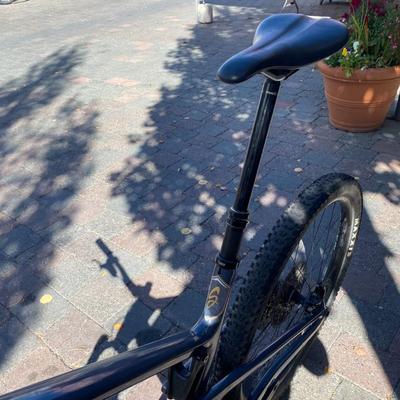 Sale Photo Thumbnail #1: The Santa Cruz Hightower S Kit is a high-quality mountain bike featuring a flat bar handlebar, 29" tubeless tires, and a lightweight carbon fiber frame. This full suspension bike includes adjustable seat, derailleur gears, and hydraulic disc brakes for op
