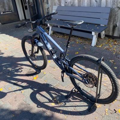 Sale Photo Thumbnail #16: The Santa Cruz Hightower S Kit is a high-quality mountain bike featuring a flat bar handlebar, 29" tubeless tires, and a lightweight carbon fiber frame. This full suspension bike includes adjustable seat, derailleur gears, and hydraulic disc brakes for op