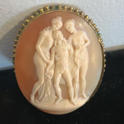 Large Victorian cameo brooch depicting the Three Graces in a gold-toned setting. 2” x 2.5”