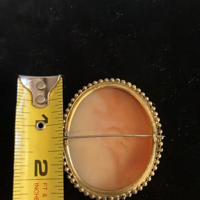 Large Victorian cameo brooch depicting the Three Graces in a gold-toned setting. 2” x 2.5”