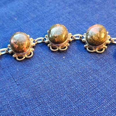 Sale Photo Thumbnail #430: This is a very striking bracelet, the stones are set in sterling silver plate settings.