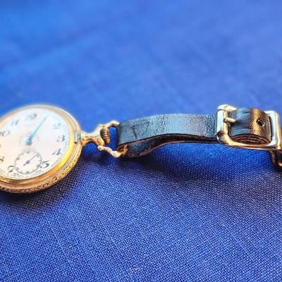 Sale Photo Thumbnail #436: with CAT Engines pocket fob
Tenco   Sacramento
The watch case has heavy repousse hunting scene on one side
The watch is not working.  17 jewel Incabloc movement
12 and 24 hour marks, Swiss made
This is a great collectible.