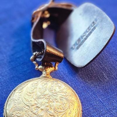 Sale Photo Thumbnail #433: with CAT Engines pocket fob
Tenco   Sacramento
The watch case has heavy repousse hunting scene on one side
The watch is not working.  17 jewel Incabloc movement
12 and 24 hour marks, Swiss made
This is a great collectible.