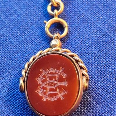 Sale Photo Thumbnail #440: Beautiful swivel watch fob with chain
Marked M & M
15-625   with an anchor mark ( 15-625 is British marking), 15 c gold, 62.5 percent pure)
Victorian  Edwardian  Art Deco Era piece