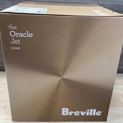 Sale Photo Thumbnail #2: The Breville Oracle Jet Espresso Machine has a powerful 1700W electrical power source and a voltage of 120V. Measuring 14.5 inches in depth, 16 3/4 inches in height, and 15 inches in width, this machine is compact and easy to fit in any kitchen. It weighs