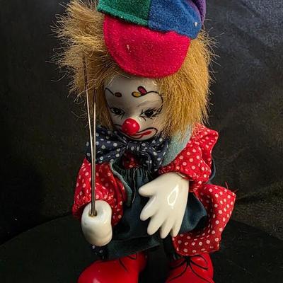 Vintage Porcelain Clown Doll with Colorful Outfit and Balloons – Whimsical Collector’s Treasure