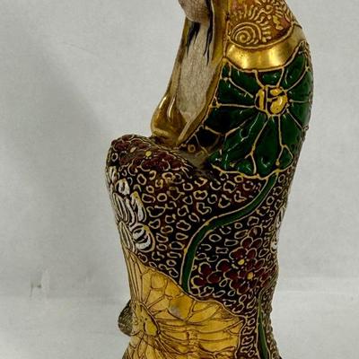 Sale Photo Thumbnail #140: Buddhist figurine of Guanyin, also known as Kannon in Japan. Satsuma ware is a type of Japanese earthenware known for its detailed, hand-painted designs and often features raised gold accents, known as moriage.  Some visible crazing on the face and chest,