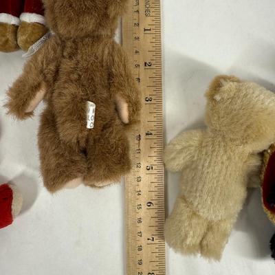 Sale Photo Thumbnail #126: 9 bears. Various colors and costumes, some are dressed like Santa.  All in good condition.