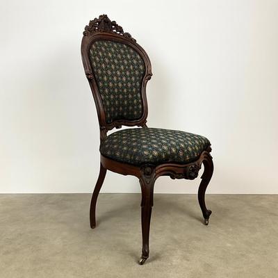 Sale Photo Thumbnail #1823: Very good condition 
upholstery is clean and free of spots or stains 
carving is in good condition 
measures 40.5" high x 19" wide x 18" deep x 18" seat height 
front less have castors