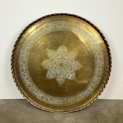 Sale Photo Thumbnail #1826: scalloped edge with floral medallion 
very good conditiion measuring 40" diameter 
x 1.5" high