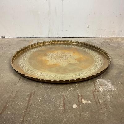 Sale Photo Thumbnail #1824: scalloped edge with floral medallion 
very good conditiion measuring 40" diameter 
x 1.5" high