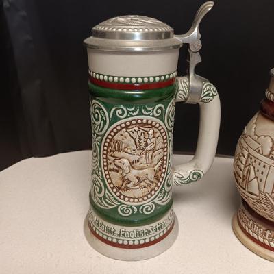 2 HAND PAINTED BEER STEINS BY AVON