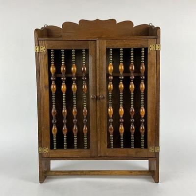 Sale Photo Thumbnail #1865: made of oak with and beaded front on cabinet doors 
with bottom towel bar 
measuring 17.75" x 5" deep x 24.5" high