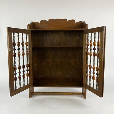 Sale Photo Thumbnail #1866: made of oak with and beaded front on cabinet doors 
with bottom towel bar 
measuring 17.75" x 5" deep x 24.5" high