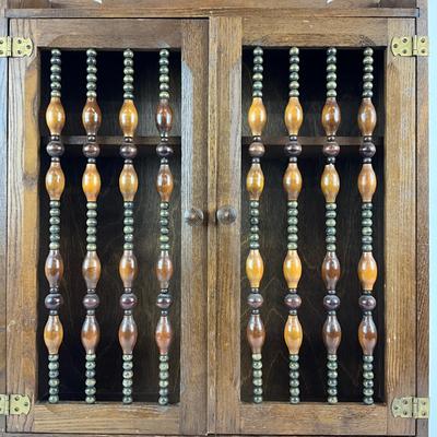 Sale Photo Thumbnail #1867: made of oak with and beaded front on cabinet doors 
with bottom towel bar 
measuring 17.75" x 5" deep x 24.5" high