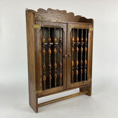 Sale Photo Thumbnail #1864: made of oak with and beaded front on cabinet doors 
with bottom towel bar 
measuring 17.75" x 5" deep x 24.5" high