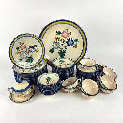Sale Photo Thumbnail #1869: One large charger 14.5" diameter, 12 salad plates 9" diameter, 1 covered sugar dish, 9 small bowls 5.5" diameter , 14 bread and butter plates, 13 saucers, 11 teacups 
all in good condition