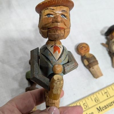 Collection of 5 Anri Hand Carved Bottle Stoppers