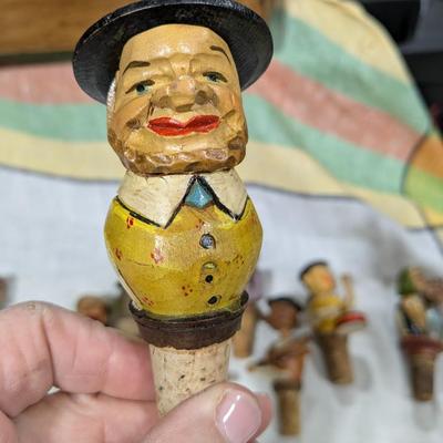 Collection of 5 Anri Hand Carved Bottle Stoppers