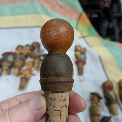 Collection of 5 Anri Hand Carved Bottle Stoppers