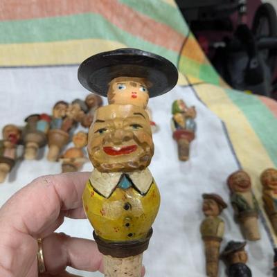 Collection of 5 Anri Hand Carved Bottle Stoppers