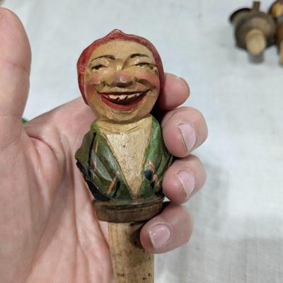 Collection of 4 ANRI Hand Carved Bottle Stoppers