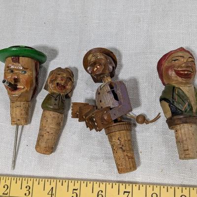 Collection of 4 ANRI Hand Carved Bottle Stoppers