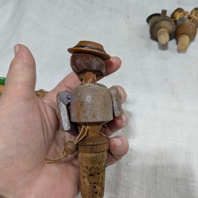 Collection of 4 ANRI Hand Carved Bottle Stoppers