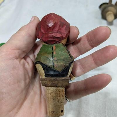 Collection of 4 ANRI Hand Carved Bottle Stoppers