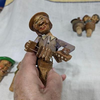 Collection of 4 ANRI Hand Carved Bottle Stoppers