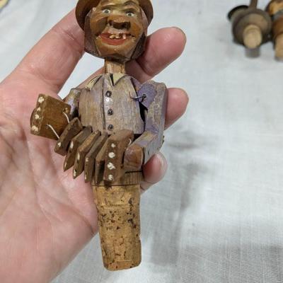 Collection of 4 ANRI Hand Carved Bottle Stoppers