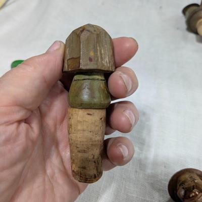 Collection of 4 ANRI Hand Carved Bottle Stoppers